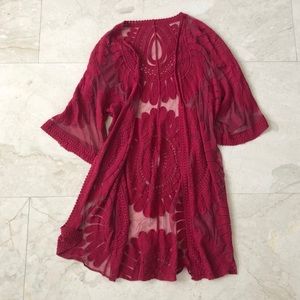 Gently worn red lace cover up
